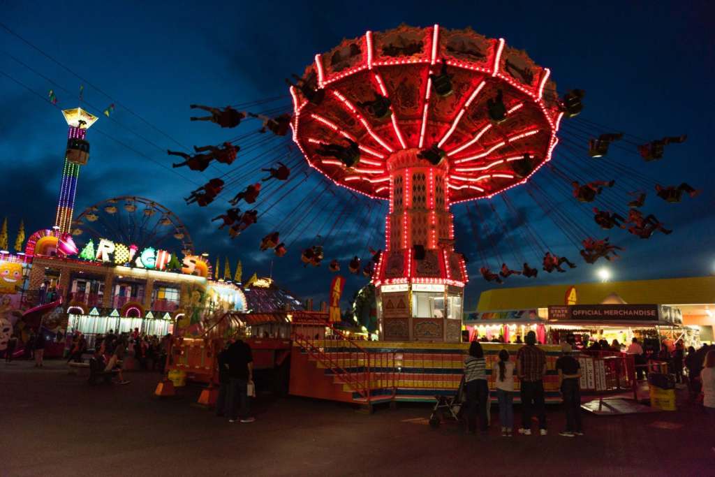 5 Fall Festivals Worth Visiting On Assignment State Fair in Puyallup at twilight. The Fair is known by locals as the Puyallup fair and has been running since 1900.