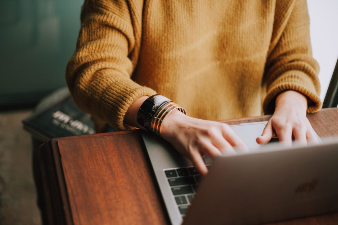 Questions to Ask During Your Hospital Interview Woman typing on a laptop