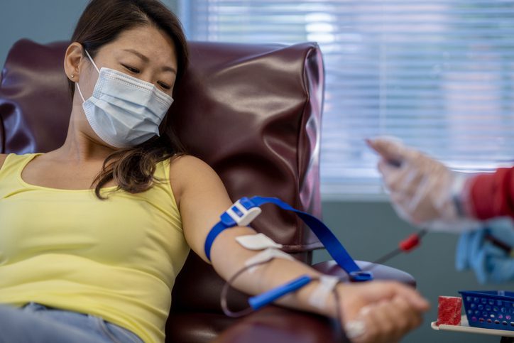 January Healthcare Awareness Days Recognized in the U.S. Masked Asian woman at a blood donation drive