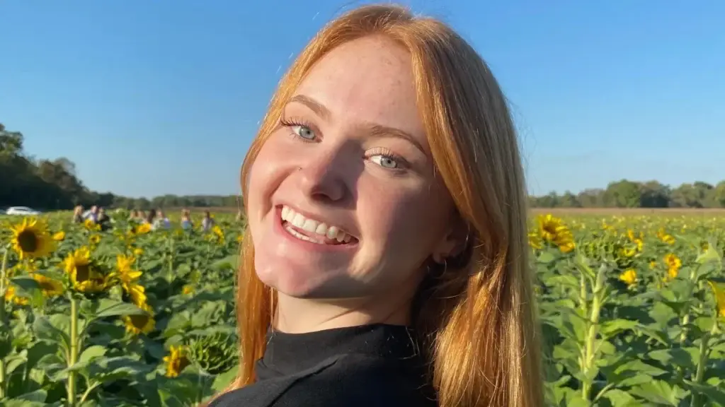 TNAA’s BSN Scholarship Winner for Fall 2022: Kaylee K. Kaylee in a sunflower field