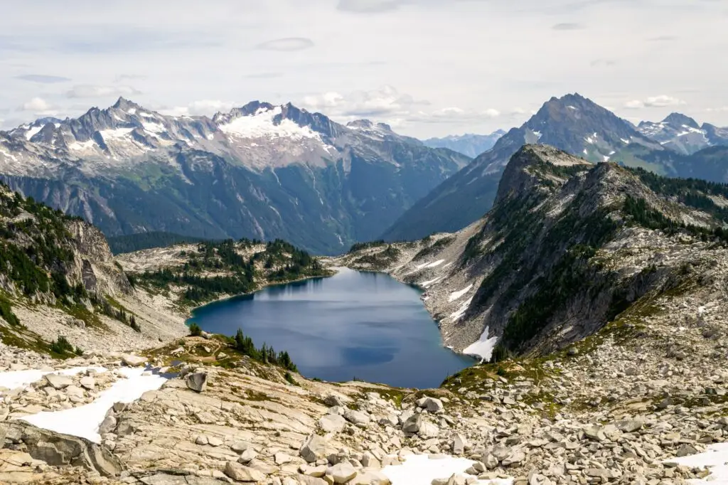 5 Mountainous National Parks and Top Hikes for the Best Views view of mountains and a lake