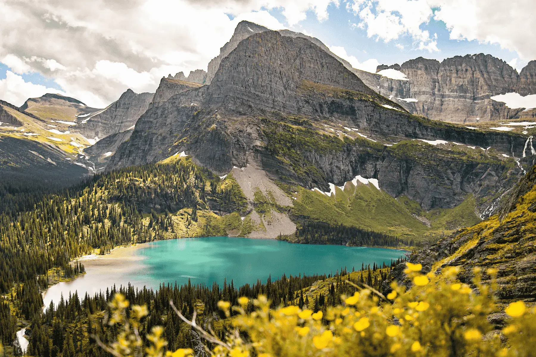 5 Mountainous National Parks and Top Hikes for the Best Views view of a mountain overlook with a lake below