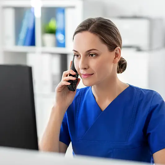 nurse on compute and phone