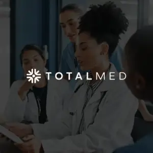 Home TotalMed logo with healthcare workers in background looking at screen